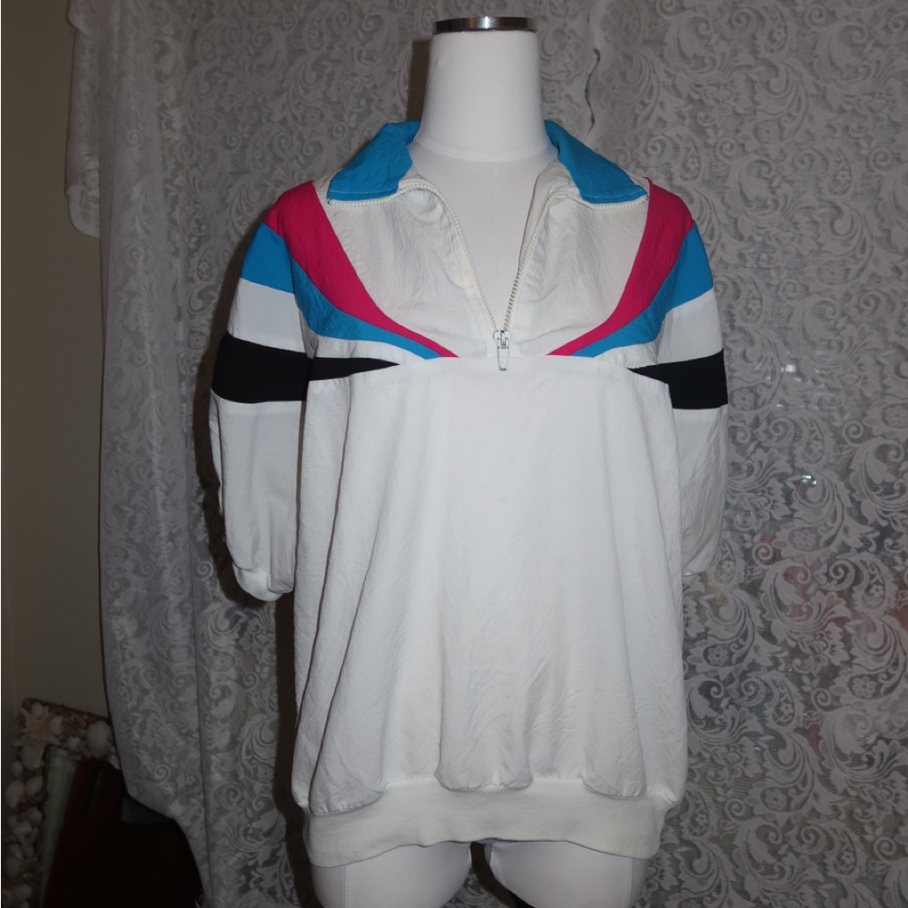 Vintage pink, blue and white Teddi Sport shirt sleeve outside gear.